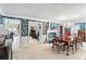 Open-concept dining room featuring detailed wallpaper, a fireplace, and ample natural light at 837 Pine Ridge Dr, Lawrenceville, GA 30043