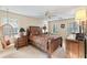 Spacious main bedroom features a hanging chair, fan, carpet, and nice wooden bedroom furniture at 837 Pine Ridge Dr, Lawrenceville, GA 30043