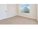 Well-lit bedroom with neutral walls and carpet flooring at 404 Discovery Ln, Ellenwood, GA 30294