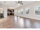 Open living space with hardwood floors and access to the kitchen at 404 Discovery Ln, Ellenwood, GA 30294