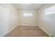 Simple bedroom with neutral decor and closet at 1583 Tanager Cir, Decatur, GA 30032