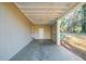 Covered carport with concrete flooring and exterior access to the home at 1583 Tanager Cir, Decatur, GA 30032