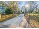 House exterior showcasing a driveway and surrounding trees at 1583 Tanager Cir, Decatur, GA 30032