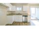 Updated kitchen, white cabinets, granite countertops, and stainless steel appliances at 1583 Tanager Cir, Decatur, GA 30032
