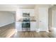 Modern kitchen with white cabinets and stainless steel appliances at 1583 Tanager Cir, Decatur, GA 30032