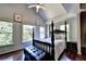 Main bedroom with hardwood floors, large windows, and a four poster bed at 340 Kincardine Way, Alpharetta, GA 30022