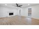 Spacious living room featuring fireplace, ceiling fan and many windows at 501 Mcdaniel Nw Rd, Marietta, GA 30064