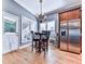 Bright kitchen nook with a charming table and chairs near the refrigerator at 109 Newcastle Walk, Woodstock, GA 30188