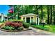 Charming community entrance with manicured landscaping and a welcoming guard house at 1382 Branch Dr # A, Tucker, GA 30084