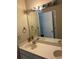 Double vanity bathroom with large mirror and light fixture at 255 Thornbush Ln, Lawrenceville, GA 30046