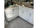 White bathroom cabinets and tiled floor at 255 Thornbush Ln, Lawrenceville, GA 30046