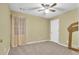 Bright bedroom with ceiling fan and neutral walls at 255 Thornbush Ln, Lawrenceville, GA 30046