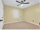 Well-lit bedroom featuring carpet floors and ceiling fan at 255 Thornbush Ln, Lawrenceville, GA 30046