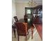 Formal dining room with dark wood table and chairs at 255 Thornbush Ln, Lawrenceville, GA 30046