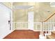 Elegant foyer with hardwood floors, wainscoting, and staircase at 255 Thornbush Ln, Lawrenceville, GA 30046