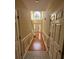 Spacious hallway with hardwood floors, and a large window at the end at 255 Thornbush Ln, Lawrenceville, GA 30046