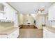 Kitchen with white cabinets, tile flooring, and a view into the Gathering room at 255 Thornbush Ln, Lawrenceville, GA 30046