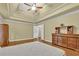 Main bedroom with hardwood floors and ceiling fan at 255 Thornbush Ln, Lawrenceville, GA 30046