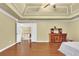 Large main bedroom with tray ceiling, hardwood floors, and ample closet space at 255 Thornbush Ln, Lawrenceville, GA 30046