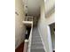 Two-story foyer with a staircase and a balcony at 255 Thornbush Ln, Lawrenceville, GA 30046