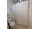 Clean bathroom with shower/tub combo and white shower curtain at 2611 Cannon Farm Ln, Duluth, GA 30097