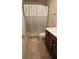 Clean bathroom with tile flooring and a shower/tub combo at 2611 Cannon Farm Ln, Duluth, GA 30097