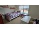 Bedroom with twin bed, desk, and large window at 2611 Cannon Farm Ln, Duluth, GA 30097