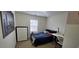 Bright bedroom with a double bed, dresser, and workspace at 2611 Cannon Farm Ln, Duluth, GA 30097