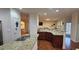 Island kitchen with granite countertops and hardwood floors at 2611 Cannon Farm Ln, Duluth, GA 30097