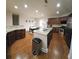 Spacious kitchen featuring granite countertops, ample cabinetry, and hardwood floors at 2611 Cannon Farm Ln, Duluth, GA 30097