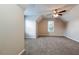 Spacious bedroom features a ceiling fan, neutral walls, and plush carpeting at 2295 Creekview Trl, Decatur, GA 30035