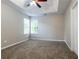 Neutral bedroom with a ceiling fan and natural light at 2295 Creekview Trl, Decatur, GA 30035