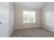 Bright bedroom with natural light, soft carpet, and neutral walls at 2295 Creekview Trl, Decatur, GA 30035