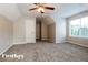 Bedroom featuring neutral walls, carpet, a ceiling fan, and a window at 2295 Creekview Trl, Decatur, GA 30035