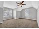 Neutral bedroom featuring carpet, a ceiling fan, and natural light from two windows at 2295 Creekview Trl, Decatur, GA 30035