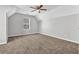 Spacious vacant room featuring a cozy carpet and a ceiling fan at 2295 Creekview Trl, Decatur, GA 30035