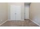 Bedroom with neutral walls, soft carpet, and two closets at 2295 Creekview Trl, Decatur, GA 30035