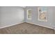 Empty room with neutral walls, carpet, and window view at 2295 Creekview Trl, Decatur, GA 30035