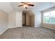 Cozy bedroom with neutral walls, soft carpet, and ample natural light at 2295 Creekview Trl, Decatur, GA 30035