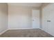 Comfortable bedroom with neutral paint, soft carpet, and a closet at 2295 Creekview Trl, Decatur, GA 30035