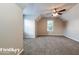 Bedroom featuring neutral walls, carpet, a ceiling fan, and a window at 2295 Creekview Trl, Decatur, GA 30035