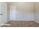 Neutral bedroom with a large closet and plush carpeting at 2295 Creekview Trl, Decatur, GA 30035