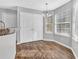 Bright dining area featuring wood floors, double door pantry, and natural light from multiple windows at 2295 Creekview Trl, Decatur, GA 30035