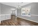 The dining room has wood floors, fresh gray paint, and ample natural light at 2295 Creekview Trl, Decatur, GA 30035