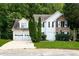 Charming two-story home with a two-car garage and a combination of stone and siding facade at 2295 Creekview Trl, Decatur, GA 30035