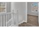 Upstairs landing with carpet and a view into the bedrooms from the hallway at 2295 Creekview Trl, Decatur, GA 30035