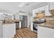 Modern kitchen with stainless steel appliances, granite countertops, and newly refinished cabinets at 2295 Creekview Trl, Decatur, GA 30035