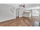 Bright and open living area showcasing wood floors, staircase, and a view into the kitchen at 2295 Creekview Trl, Decatur, GA 30035