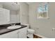 Simple bathroom with vanity, toilet, and window at 3029 Oakvale Hts, Decatur, GA 30034