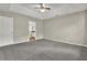 Spacious bedroom with grey carpet and ceiling fan at 3029 Oakvale Hts, Decatur, GA 30034